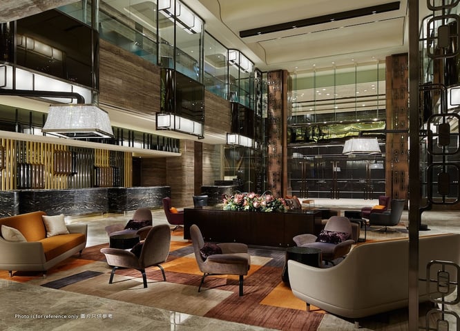 a lobby with a lot of furniture and a lot of lights