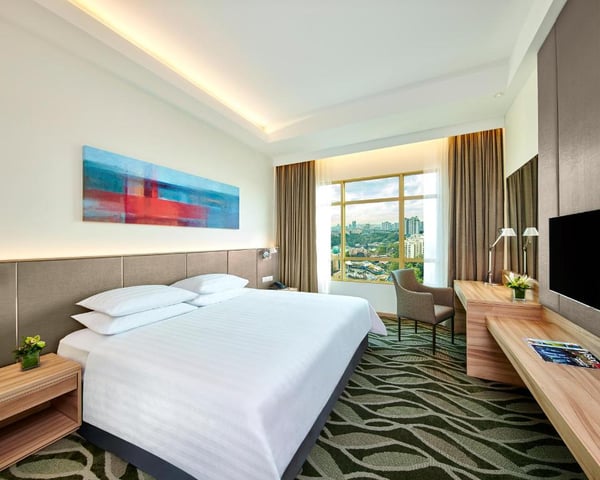 a bed or beds in a room at hotel grand