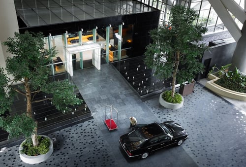 a car is parked in a large atrium