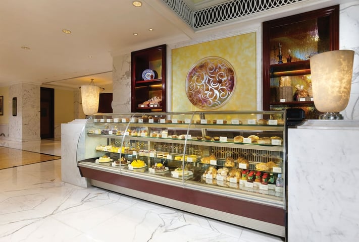 a large marble counter with a display case